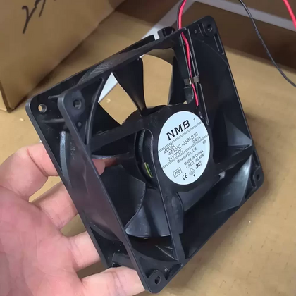 External reference: NMB 4715KL-05W-B30 P00, DC24V 0.40A; handheld reference with two red/black leads. Different label version from historical P14; equivalence unverified. Image does not prove the actual shipping unit, condition or supplied full option. Verify measured fit, connector and pinout before ordering; lead count does not establish control functions.