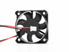 Open-corner axial fan with white plug — retouched existing listing photograph, blade-side view; model and pinout unconfirmed